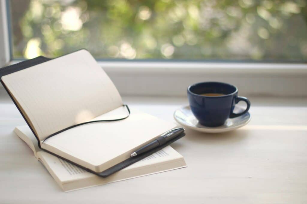 How to Build a Morning Routine That Reduces Stress and Boosts Productivity 1 Calm morning setup with coffee journal and sunlight