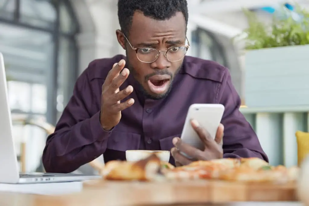 Digital Detox: How to Reduce Screen Time and Reclaim Your Focus 1 Illustration of someone stressed out by phone notifications