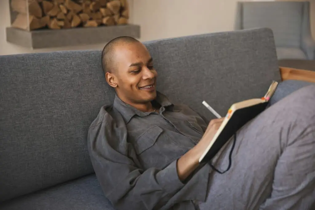 The Power of Gratitude: How Practicing Daily Gratitude Improves Mental Health and Happiness 1 man Practicing daily gratitude through journaling for happiness