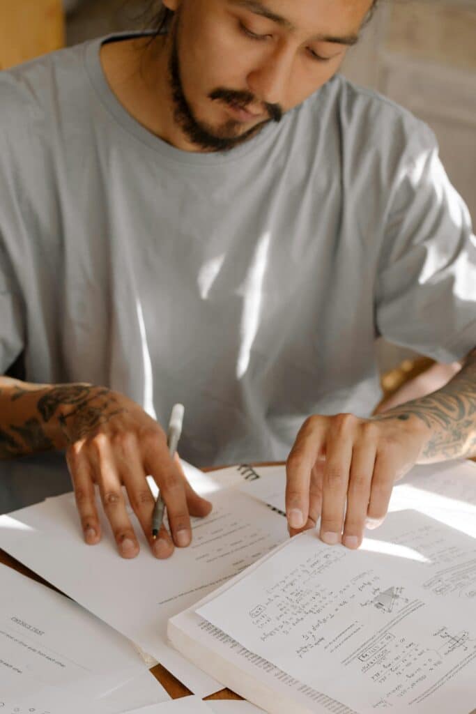 10 Science-Backed Benefits of Mindfulness for Everyday Life 2 man focusing on writing