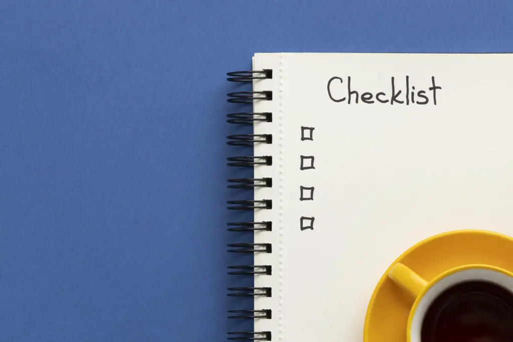 The Role of Self-Discipline in Achieving Long-Term Goals 2 notebook with list desk with cup coffee beside