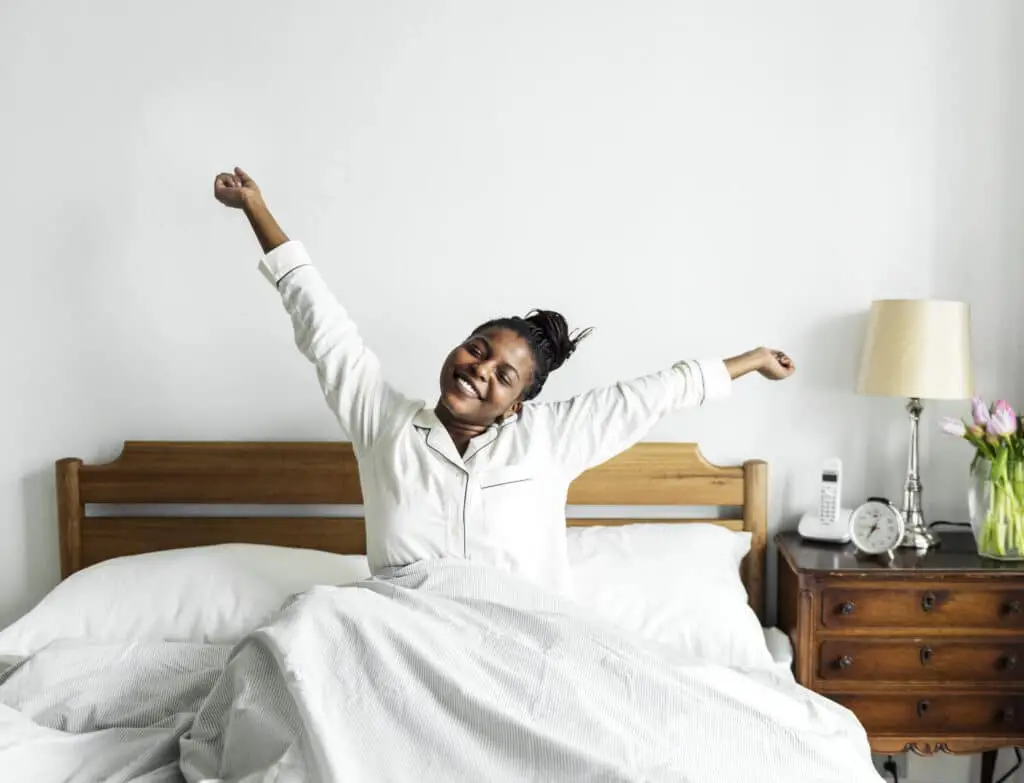 The Science of Sleep: How Better Rest Improves Mental Clarity and Productivity 3 woman waking up feeling refreshed after healthy sleep