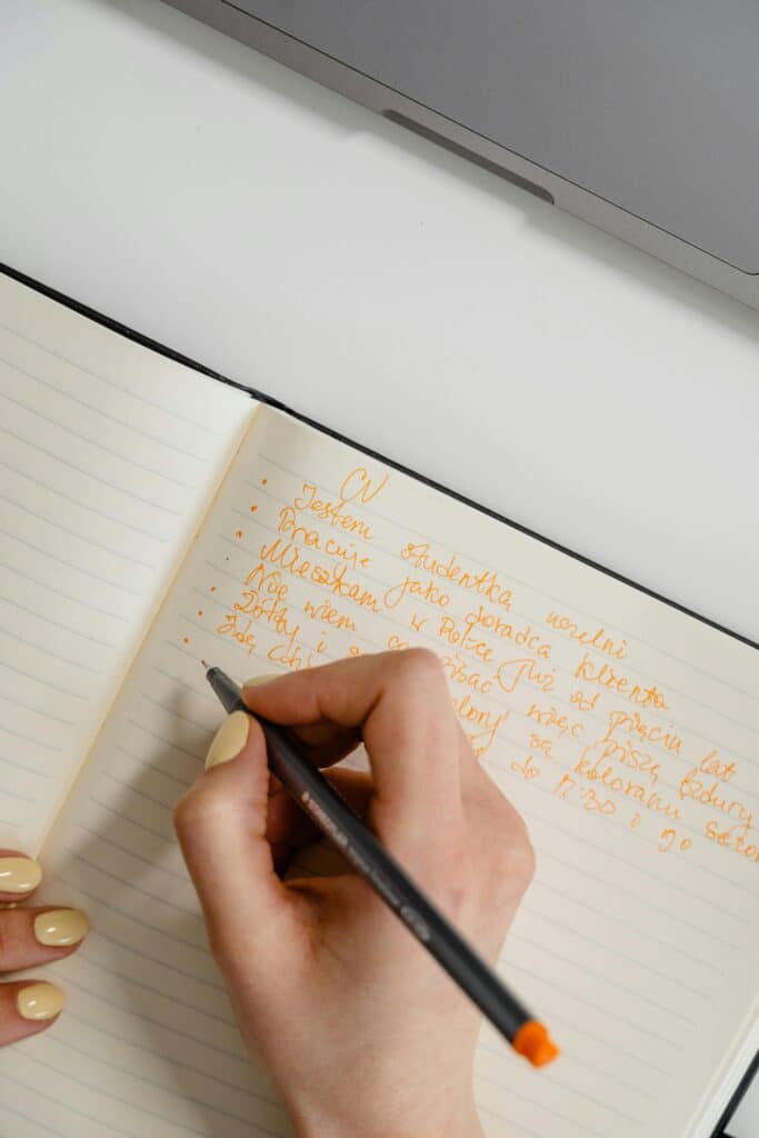 10 Morning Habits of Highly Productive People 6 woman writing on a journal book