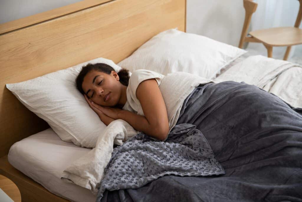 Title: 5 Natural Ways to Reduce Stress and Anxiety 4 young lady sleeping comfortably on the bed