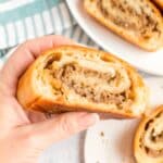Sliced golden-brown Mozzarella Sausage Bread showing the savory filling swirl